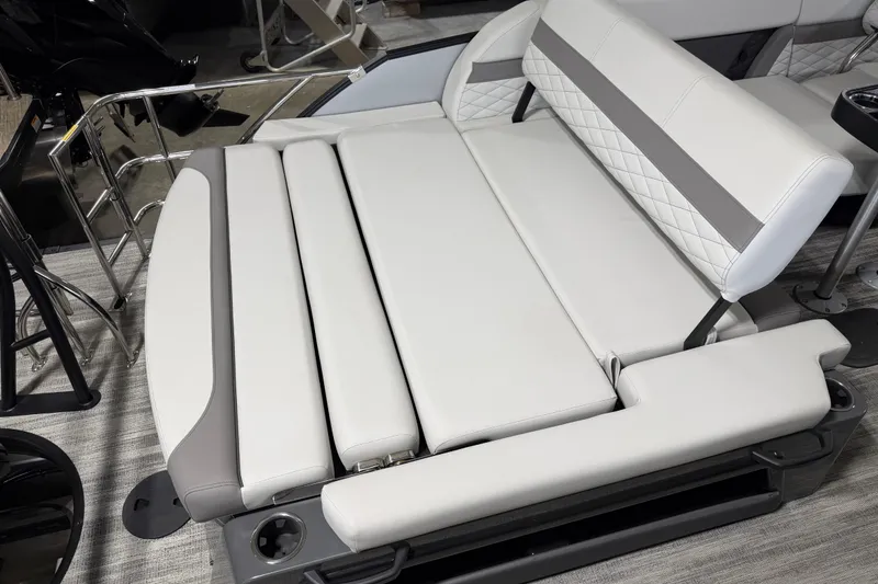 Slide: The Image of Luxurious seating on 2026 Godfrey Monaco 235 SFL pontoon boat, featuring elegant upholstery and design. - 10