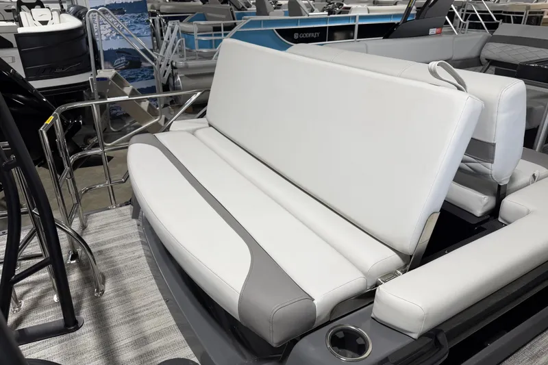 Slide: The Image of 2026 Godfrey Monaco 235 SFL boat interior with sleek white seating and modern design. - 11