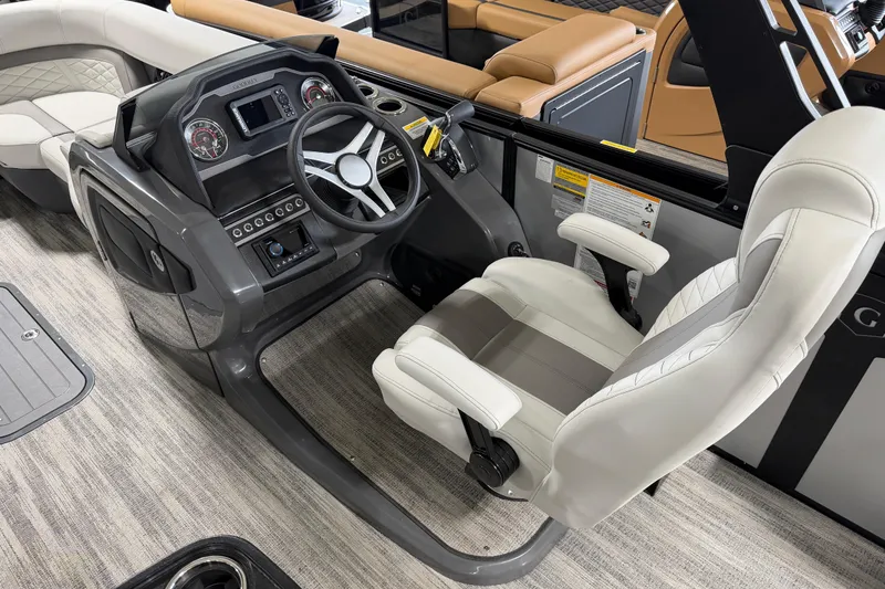 Slide: The Image of 2026 Godfrey Monaco 235 SFL boat interior with modern helm and luxurious seating. - 9