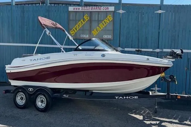 The Image of 2018 Tahoe 500 TF boat with red and white design on a trailer. - 0