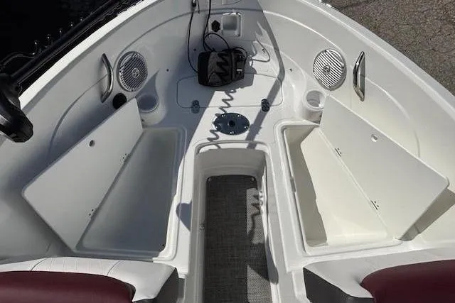 Slide: The Image of 2018 Tahoe 500 TF boat interior with open storage compartments and speakers. - 12