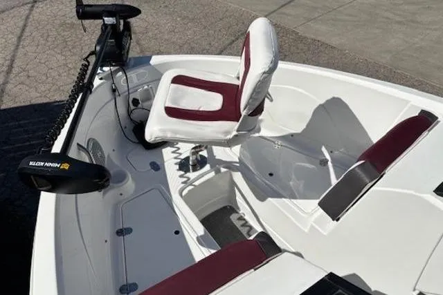 Slide: The Image of 2018 Tahoe 500 TF boat interior with maroon and white seating, featuring a trolling motor. - 14