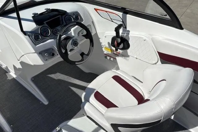 Slide: The Image of Cockpit of 2018 Tahoe 500 TF boat with white and maroon seating. - 16