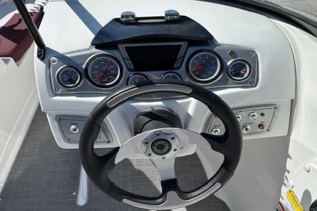Slide: The Image of Steering console of a 2018 Tahoe 500 TF boat with gauges and controls. - 17