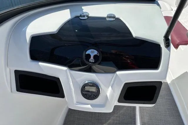 Slide: The Image of Dashboard of a 2018 Tahoe 500 TF boat with sleek black and white design. - 21