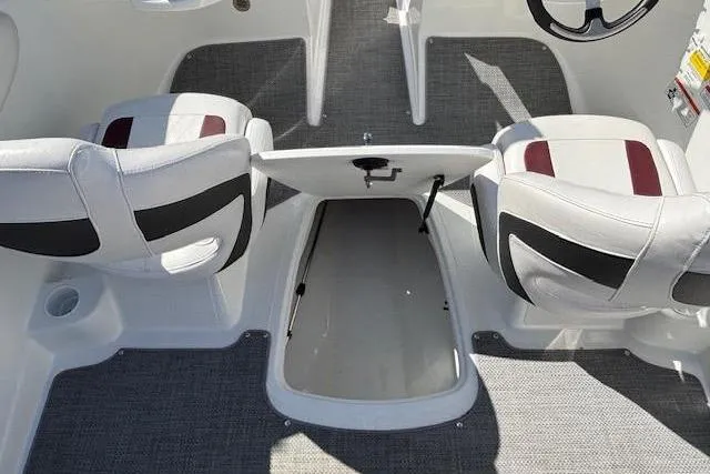 Slide: The Image of Interior of 2018 Tahoe 500 TF boat with open storage compartment and two seats. - 26