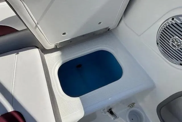 Slide: The Image of Open storage compartment in 2018 Tahoe 500 TF boat interior. - 30