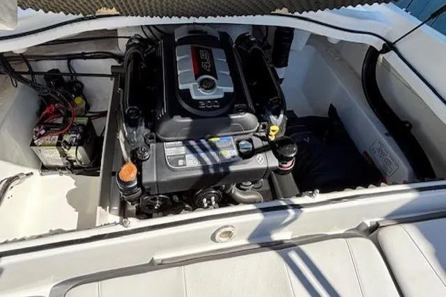 Slide: The Image of 2018 Tahoe 500 TF boat engine compartment with visible battery and wiring. - 34