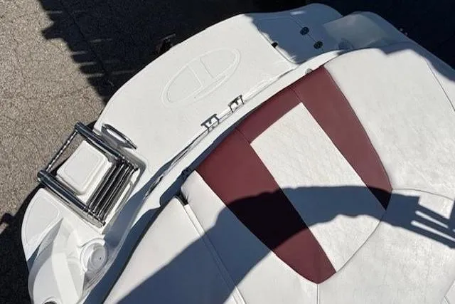 Slide: The Image of 2018 Tahoe 500 TF boat with white and maroon seating, featuring a foldable ladder. - 35