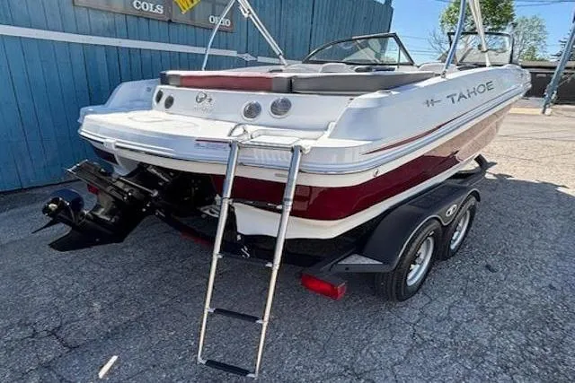 Slide: The Image of 2018 Tahoe 500 TF boat on trailer, rear view with ladder and outboard motor. - 4
