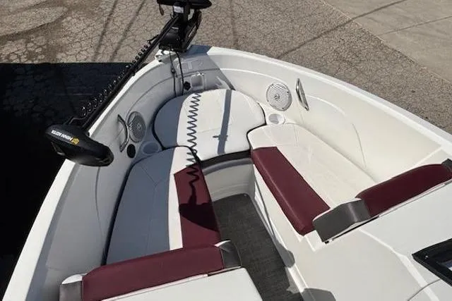 Slide: The Image of 2018 Tahoe 500 TF boat interior with white and maroon seating, featuring a trolling motor. - 9