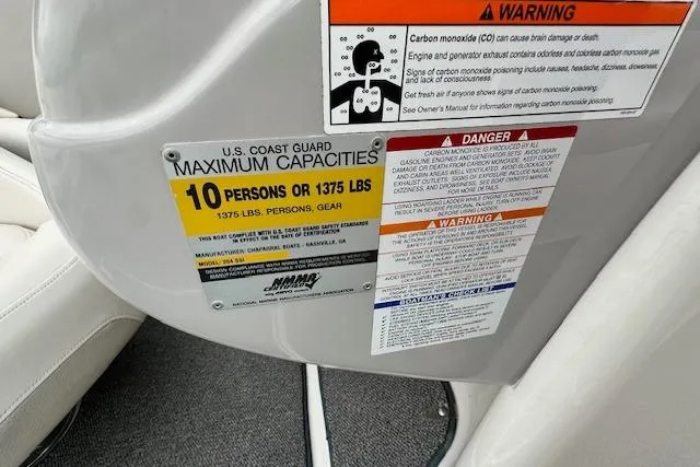 Slide: The Image of 2007 Chaparral 204 SSi boat capacity warning labels, indicating a maximum of 10 persons or 1375 lbs. - 12