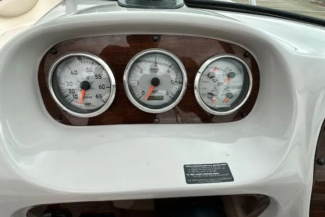 Slide: The Image of Dashboard of a 2007 Chaparral 204 SSi boat with speedometer and gauges. - 14