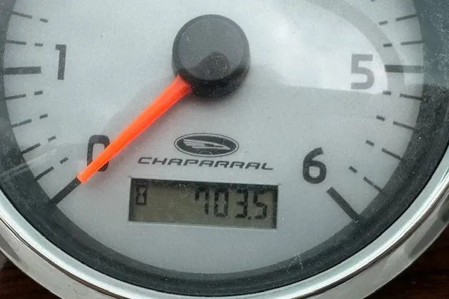 Slide: The Image of Close-up of a 2007 Chaparral 204 SSi boat tachometer displaying 703.5 hours. - 19
