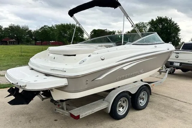 Slide: The Image of 2007 Chaparral 204 SSi boat on trailer, parked outdoors, with overcast sky. - 2