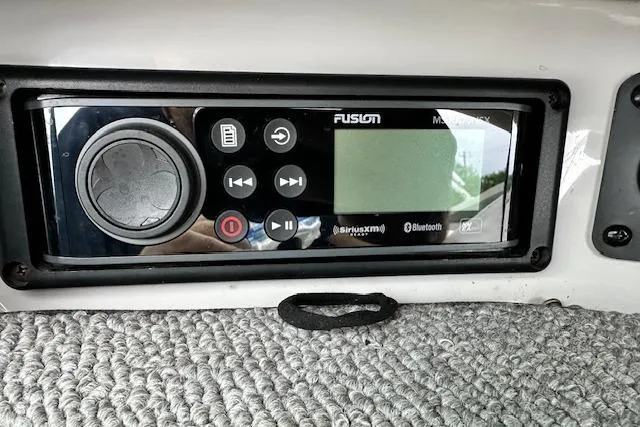 Slide: The Image of Fusion marine stereo system in a 2007 Chaparral 204 SSi boat dashboard. - 20