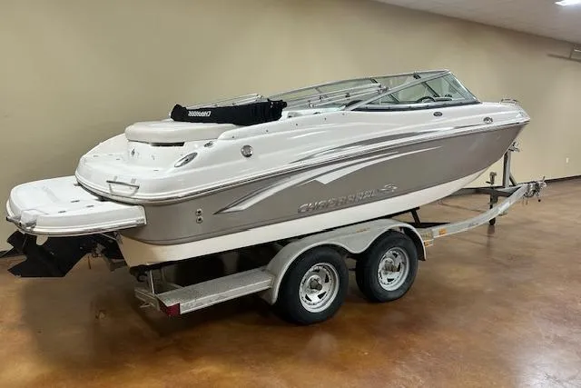 Slide: The Image of 2007 Chaparral 204 SSi boat on trailer, displayed indoors, side view. - 22