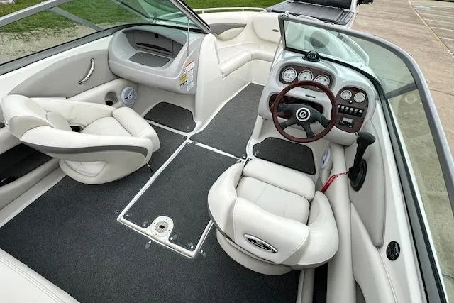 Slide: The Image of 2007 Chaparral 204 SSi boat interior with plush seating and modern dashboard. - 5
