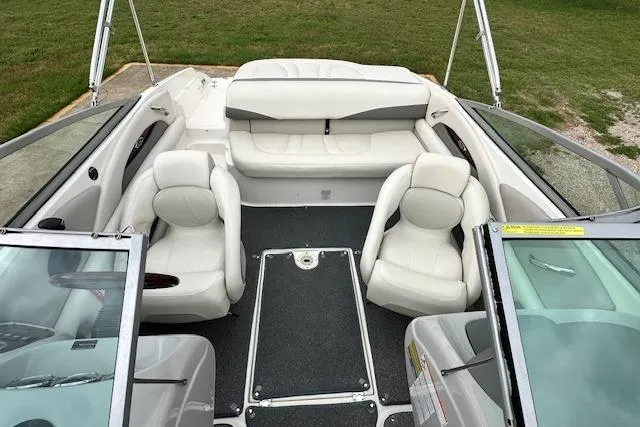 Slide: The Image of Interior view of a 2007 Chaparral 204 SSi boat with white seating and open deck. - 6