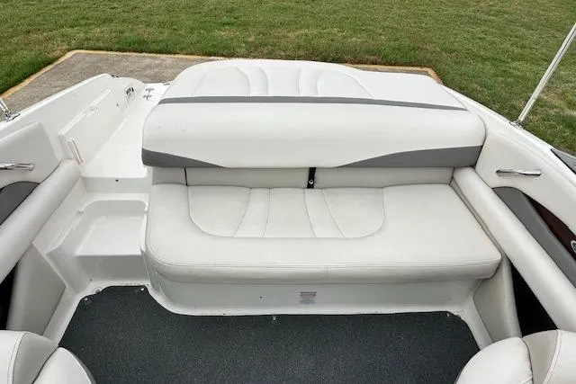 Slide: The Image of 2007 Chaparral 204 SSi boat interior with white cushioned seating and gray accents. - 7