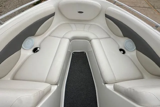 Slide: The Image of 2007 Chaparral 204 SSi boat interior with white and gray seating. - 9