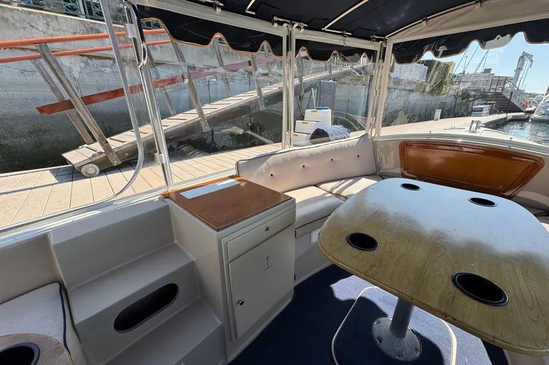 Slide: The Image of Interior of a 2008 Duffy Snug Harbor 18 boat with seating and table. - 5
