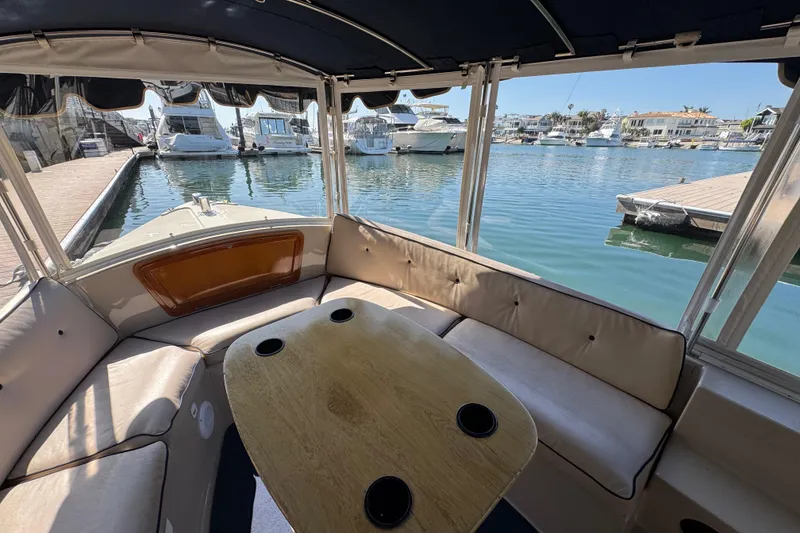 Slide: The Image of Interior view of a 2008 Duffy Snug Harbor 18 boat docked at a marina. - 7