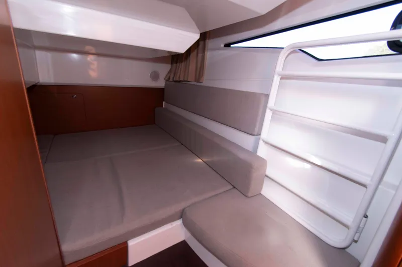 Slide: The Image of Interior cabin of 2017 Jeanneau NC 895 boat, featuring cozy seating and modern design. - 20