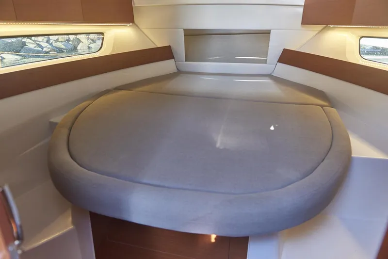 Slide: The Image of Interior of 2017 Jeanneau NC 895 boat with wooden cabinetry and seating. - 6