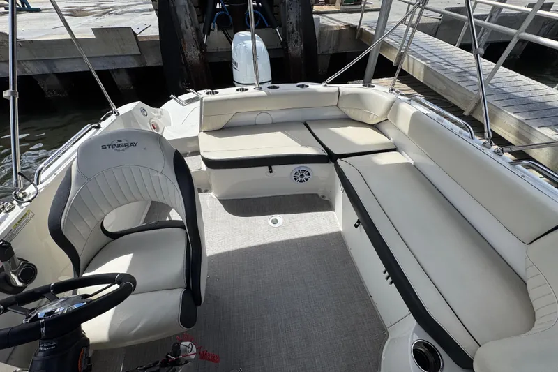 Slide: The Image of 2022 Stingray 192 SC boat interior with spacious seating and modern design. - 5