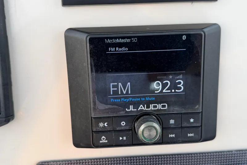 Slide: The Image of JL Audio MediaMaster 50 radio display on 2023 Boston Whaler 220 Dauntless boat. - 43