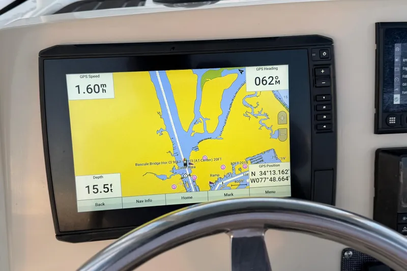 Slide: The Image of GPS navigation screen on 2023 Boston Whaler 220 Dauntless boat dashboard. - 44
