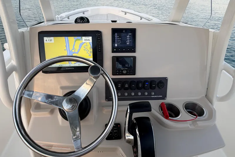 Slide: The Image of 2023 Boston Whaler 220 Dauntless helm with Garmin navigation and control panel. - 46