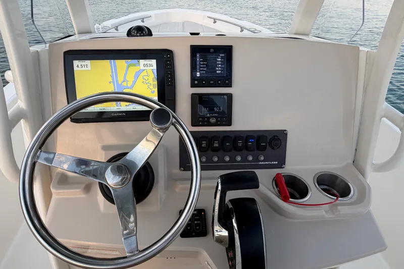 Slide: The Image of 2023 Boston Whaler 220 Dauntless helm with Garmin navigation and control panel. - 47