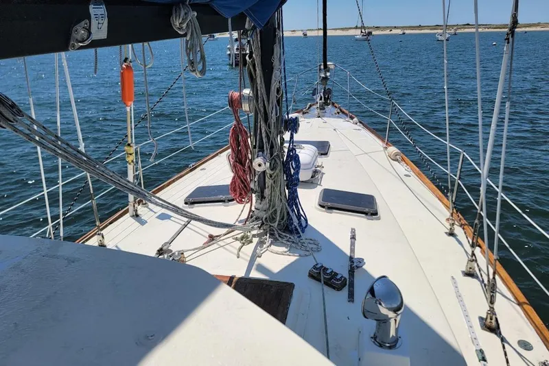 Slide: The Image of 1981 CT 47 sailboat deck with ropes and ocean view. - 3