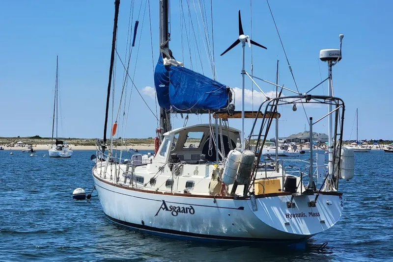 Slide: The Image of Sailboat "Asgaard" anchored in Hyannis, Massachusetts, featuring a CT 47 model from 1981. - 1