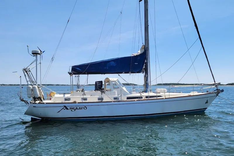 Slide: The Image of Sailboat "Asgaard" on water, CT 47 model, 1981, with blue sail cover. - 6