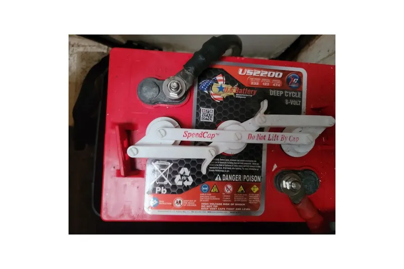 Slide: The Image of Red deep cycle 6-volt battery with warning labels and SpeedCap feature. - 44