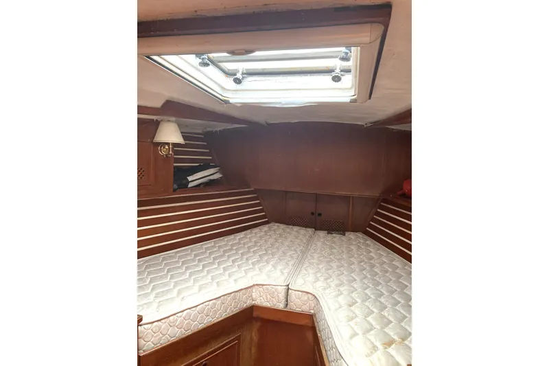 Slide: The Image of Cozy cabin interior of 1982 CT 47 sailboat with twin mattresses and skylight. - 38
