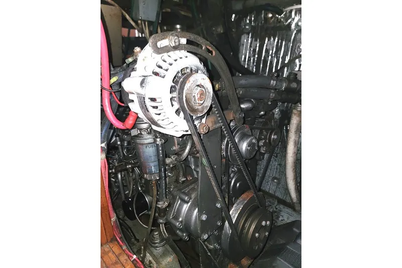 Slide: The Image of 1982 CT 47 engine with alternator and belts in detailed view. - 42