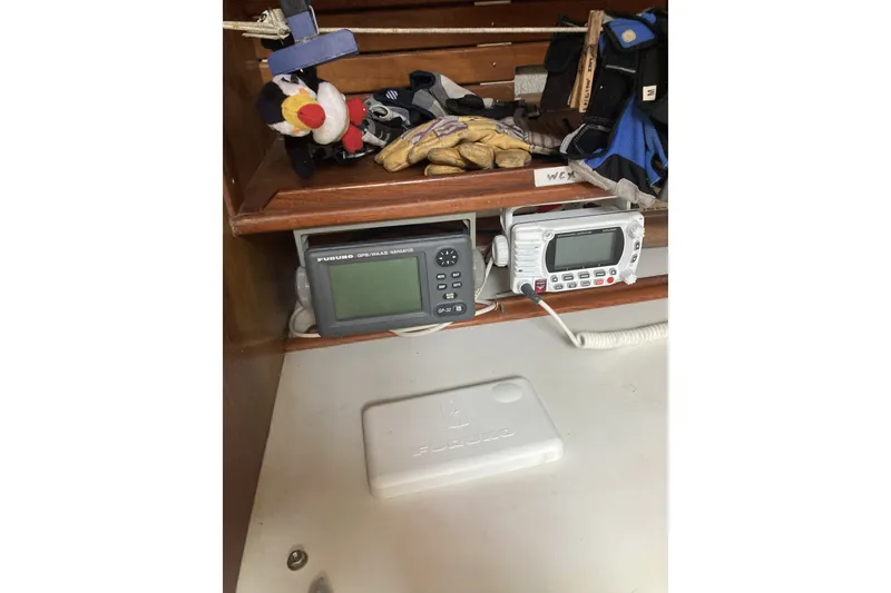 Slide: The Image of Nautical equipment on a CT 47 boat, featuring Furuno GPS and radio devices, 1982 model. - 40