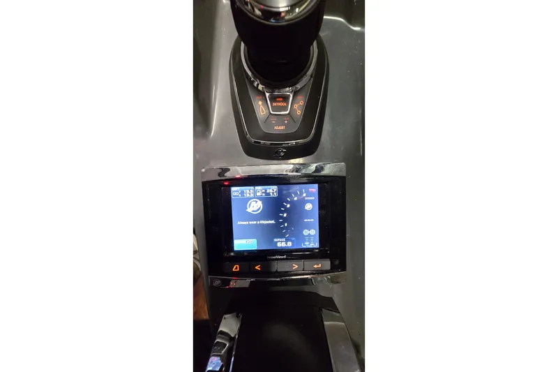 Slide: The Image of Control panel of 2018 Four Winns V355 boat with digital display and controls. - 13