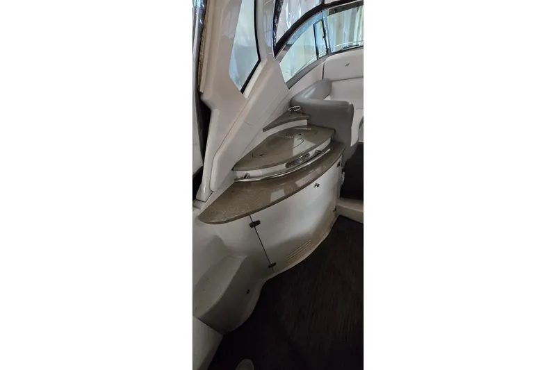 Slide: The Image of 2018 Four Winns V355 boat interior with sleek countertop and modern design. - 18