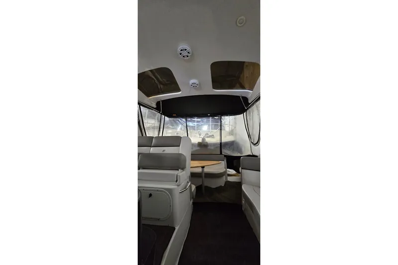 Slide: The Image of Interior view of 2018 Four Winns V355 boat with seating and table. - 21