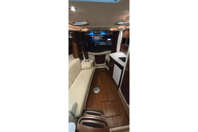 Slide: The Image of Interior of 2018 Four Winns V355 yacht with modern seating and kitchenette. - 25