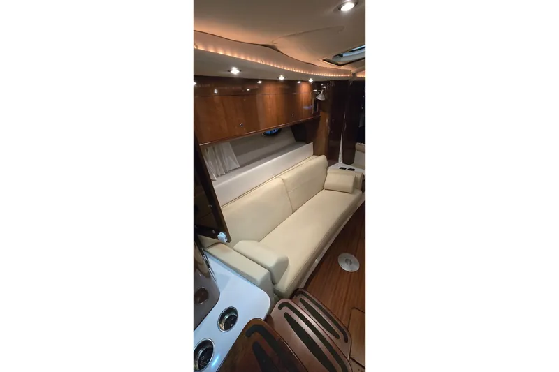 Slide: The Image of Luxurious interior of 2018 Four Winns V355 yacht with elegant seating and wood finishes. - 26
