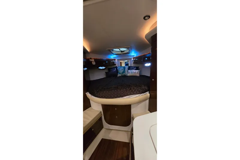 Slide: The Image of Luxurious interior cabin of 2018 Four Winns V355 boat with cozy bedding. - 28