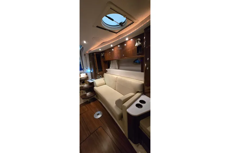 Slide: The Image of Luxurious interior of 2018 Four Winns V355 yacht with elegant seating and ambient lighting. - 29