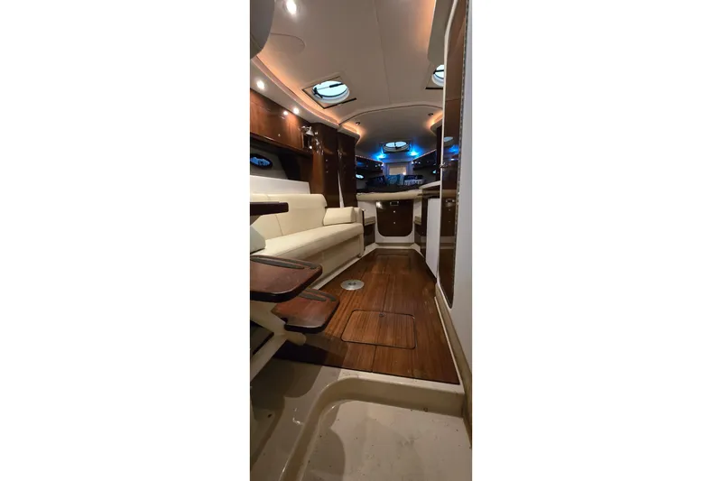 Slide: The Image of Interior of 2018 Four Winns V355 yacht with elegant wood and leather furnishings. - 32