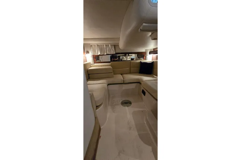 Slide: The Image of Interior of a 2018 Four Winns V355 yacht with beige seating. - 33